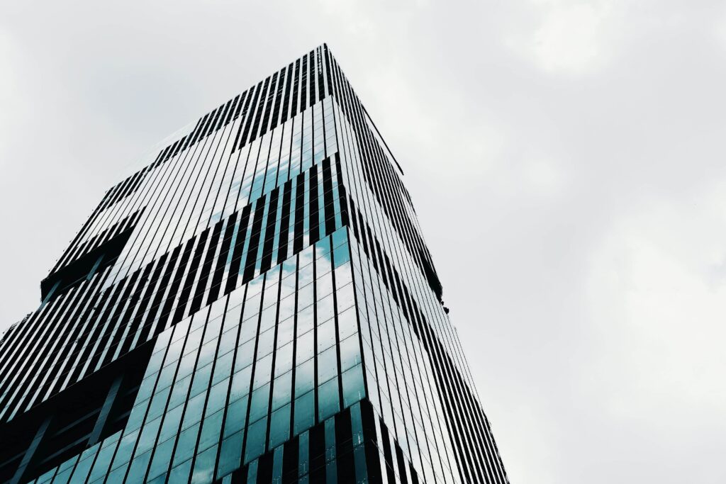 low-angle-shot-tall-high-rise-modern-business-building-with-clear-sky_1